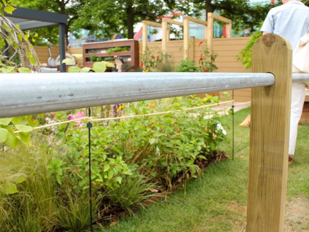 wooden post metal bar fencing
