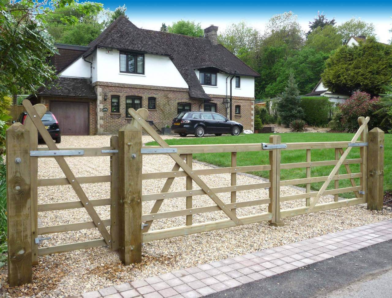 Timber entrance gates on driveway