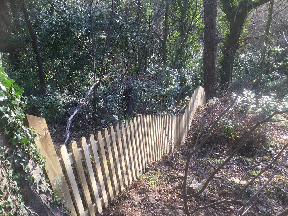 Traditional Fence On A Slope